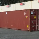 Red 40ft high cube cargo worthy shipping container with doors closed in the Dry Box yard