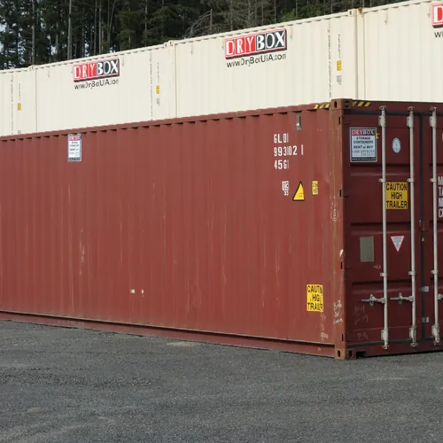 Red 40ft high cube cargo worthy shipping container with doors closed in the Dry Box yard