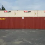 Side view of a red 40ft high cube cargo worthy shipping container
