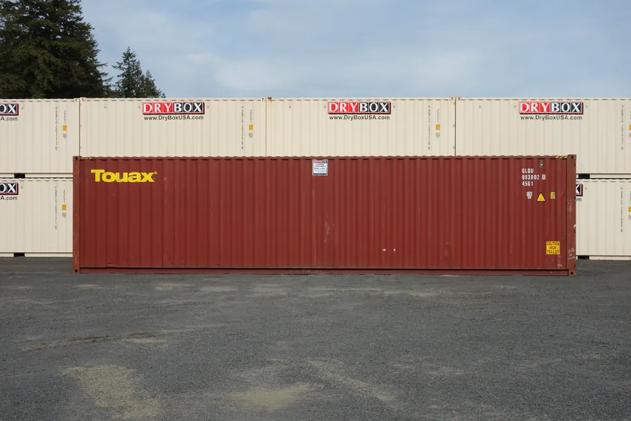 Side view of a red 40ft high cube cargo worthy shipping container