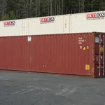 Red 40ft high cube cargo worthy shipping container among stacked Dry Box containers