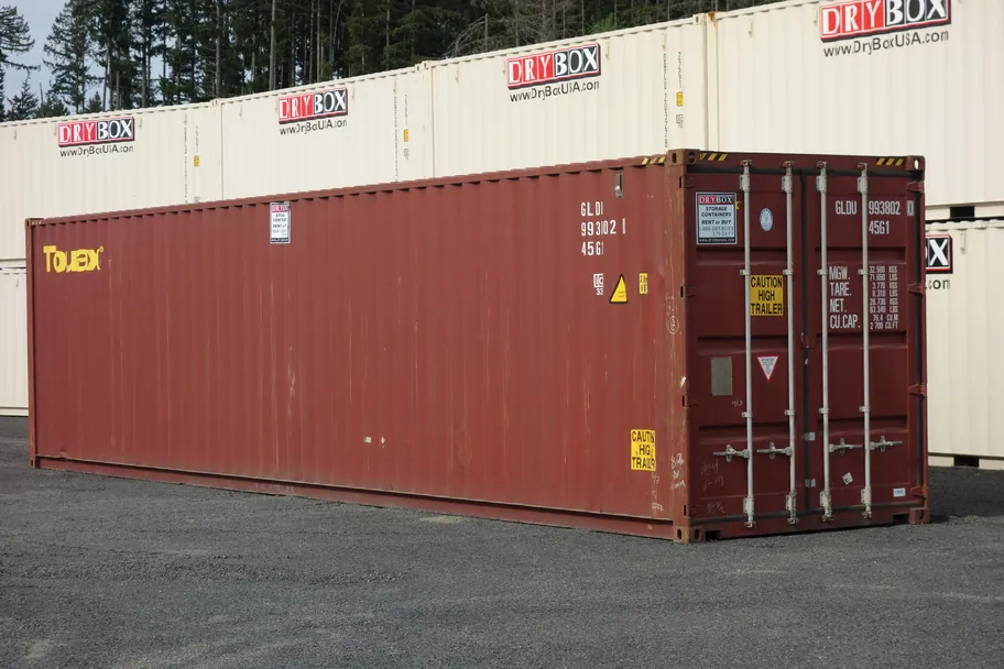 Red 40ft high cube cargo worthy shipping container with doors closed in the Dry Box yard