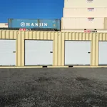 40ft container in the Dry Box yard with four rollup doors closed