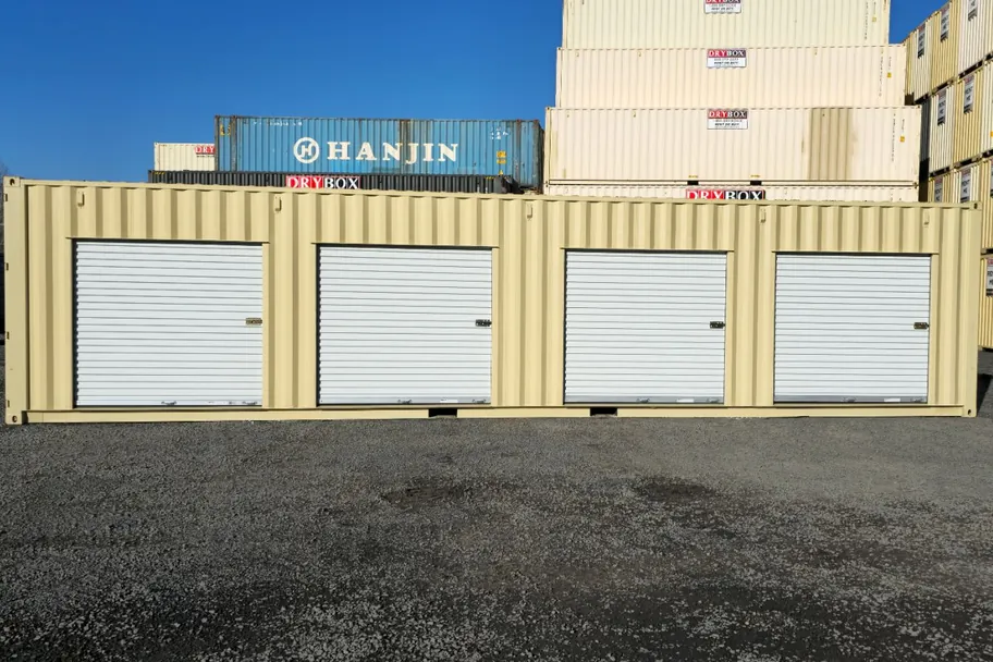 40ft container in the Dry Box yard with four rollup doors closed
