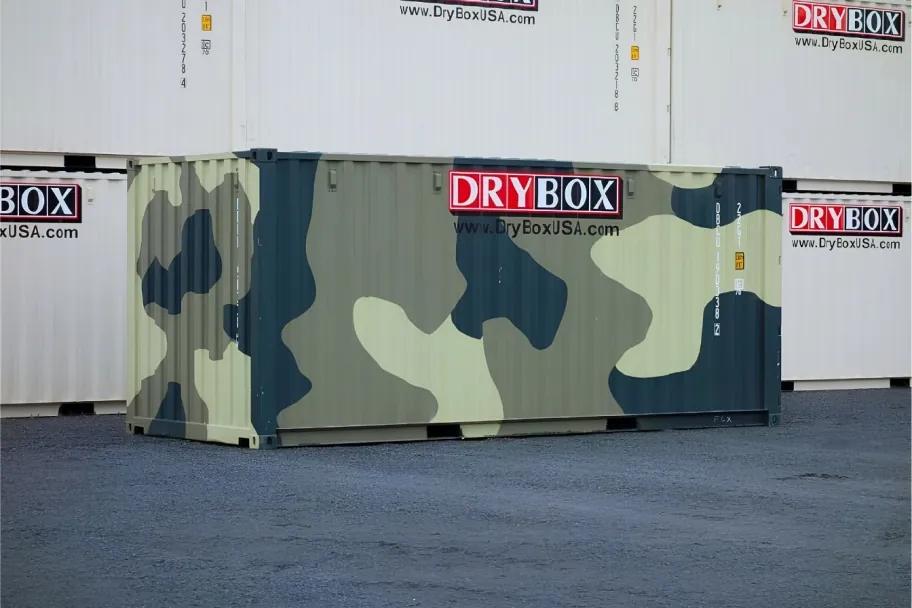A camo painted 20ft shipping container in a Dry Box yard