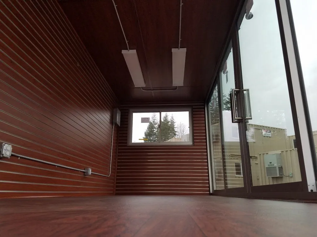 burnt red shipping container pop up store