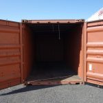 burnt red shipping container