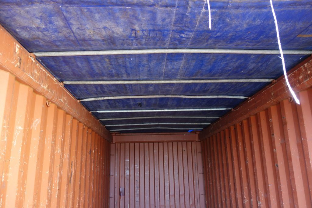 burnt red shipping container