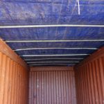 burnt red shipping container