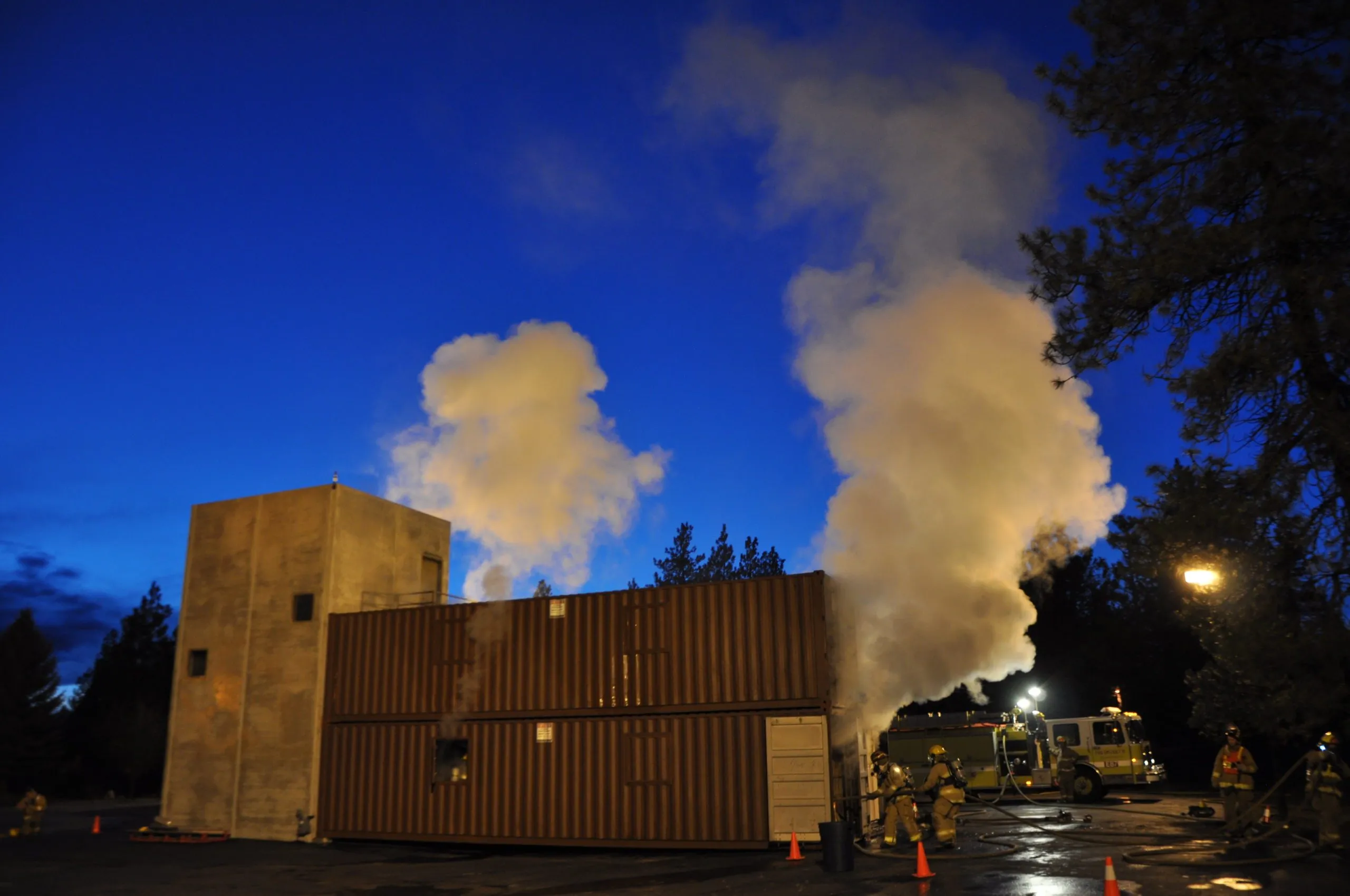 fire and smoke coming from shipping container