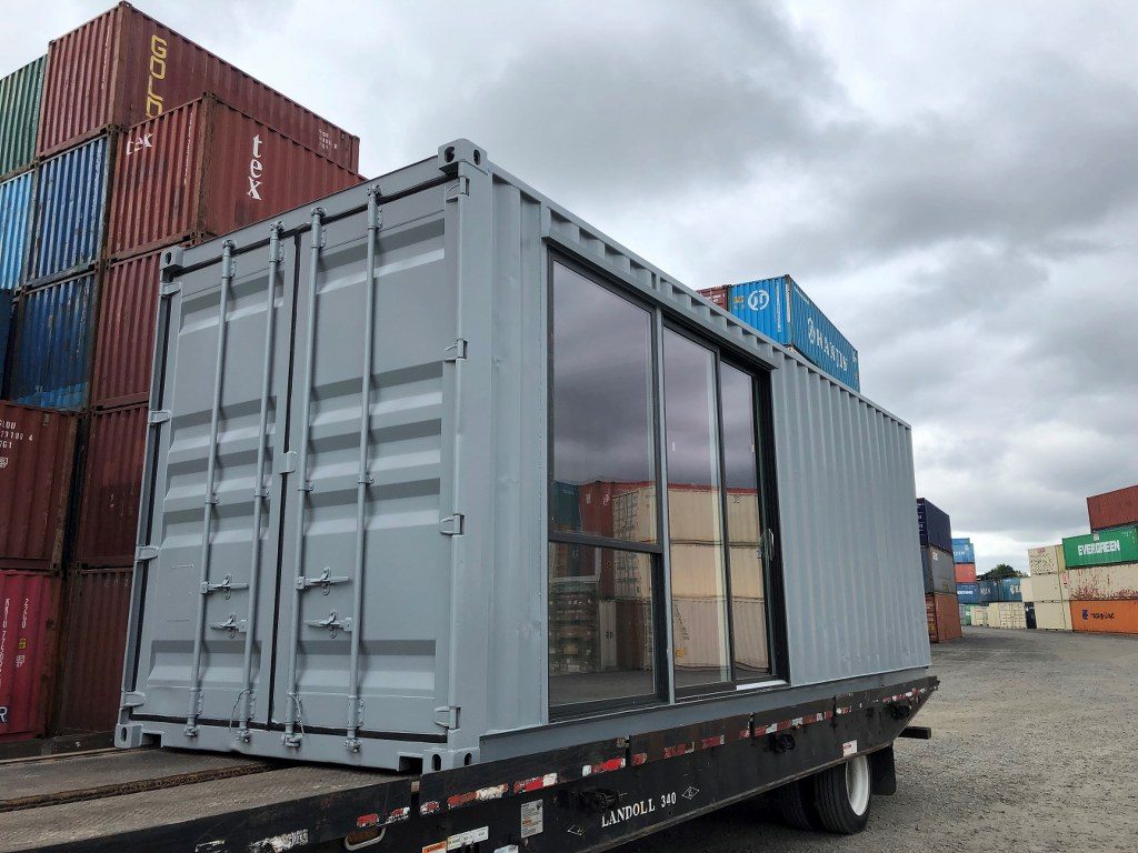 container on back of truck prepared for shipping container delivery