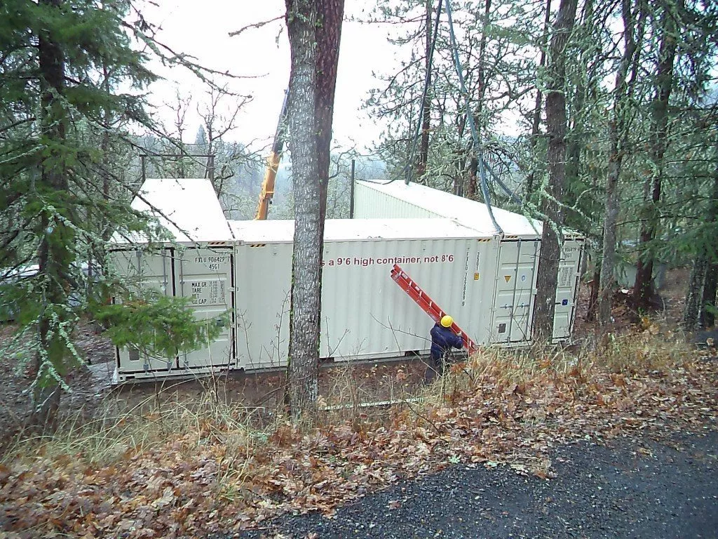 shipping containers in the forest