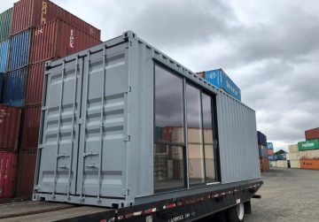 container on back of truck prepared for shipping container delivery