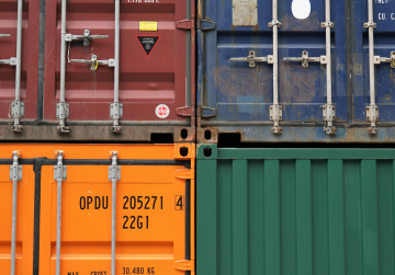 burgundy blue green and orange shipping container