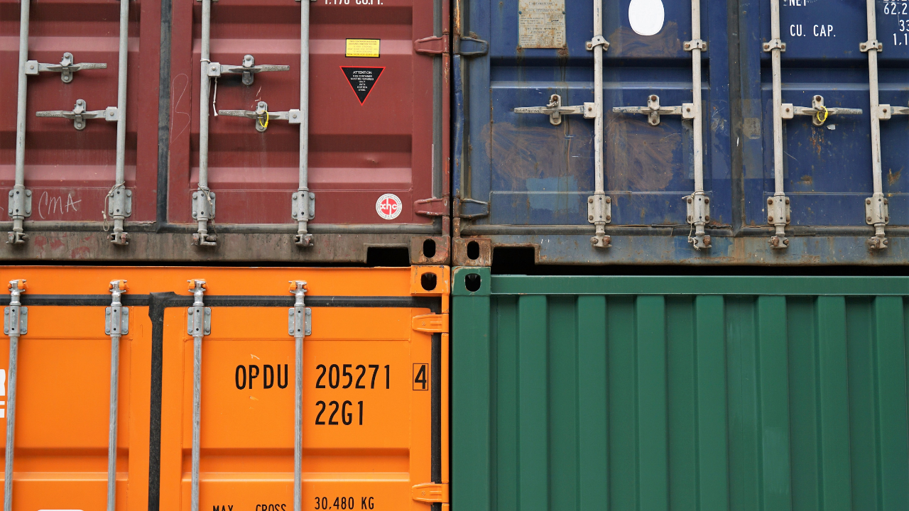 burgundy blue green and orange shipping container