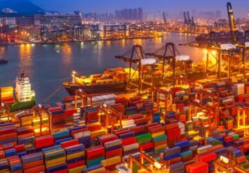aerial view of shipping containers at a seaport at night