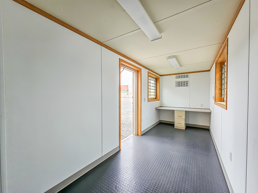 Inside a twenty-foot ground level office container