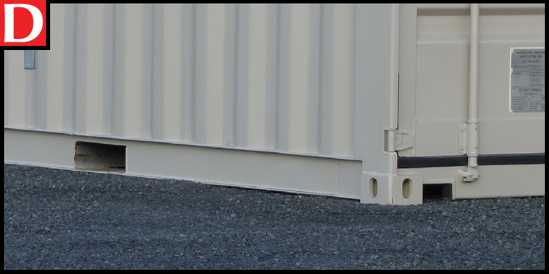 A gravel pad foundation for a container home