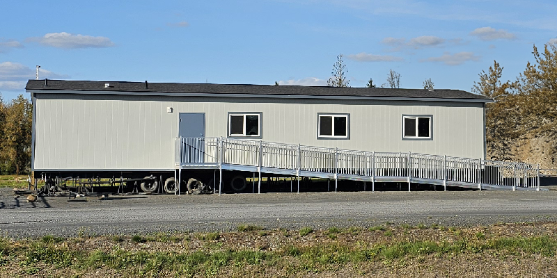 A modular office trailer with a OSHA certified ramp.