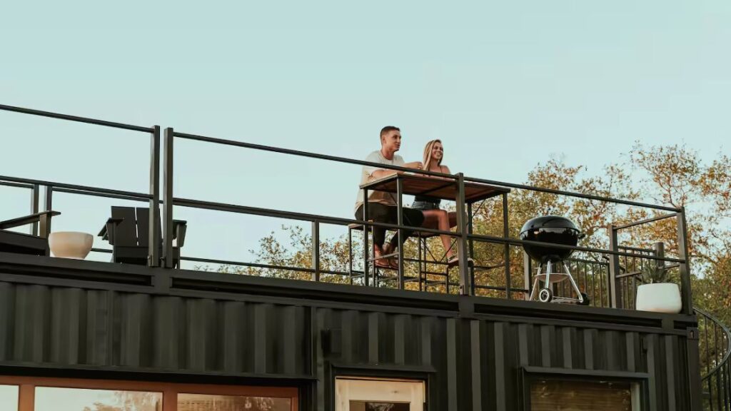 shipping container home with a patio roof